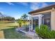 Beautiful backyard features a pond view, screened-in lanai, and lush landscaping at 8079 36Th Street E Cir, Sarasota, FL 34243