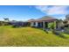 Large backyard with screened lanai, covered patio, and room for outdoor living at 8079 36Th Street E Cir, Sarasota, FL 34243