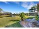 Expansive backyard with a tranquil pond view offers a serene outdoor escape at 8079 36Th Street E Cir, Sarasota, FL 34243