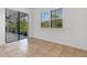 Bright dining room featuring sliding glass doors to a screened in patio at 8079 36Th Street E Cir, Sarasota, FL 34243