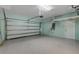 Clean and spacious garage with ample storage space, epoxy flooring, and an automatic door opener at 8079 36Th Street E Cir, Sarasota, FL 34243