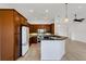 Kitchen featuring dark wood cabinetry, granite countertops, and modern appliances at 8079 36Th Street E Cir, Sarasota, FL 34243