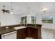 Open kitchen bar area featuring sleek countertops and stylish lighting fixtures at 8079 36Th Street E Cir, Sarasota, FL 34243