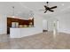 Open kitchen featuring dark wood cabinetry, granite countertops, and modern appliances at 8079 36Th Street E Cir, Sarasota, FL 34243