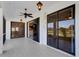 Covered screened-in lanai with sliding doors providing seamless access to the home's interior and a picturesque outdoor view at 8079 36Th Street E Cir, Sarasota, FL 34243