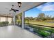 Screened-in lanai offering beautiful views of the backyard and perfect for outdoor relaxation and enjoyment at 8079 36Th Street E Cir, Sarasota, FL 34243