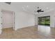 Spacious living room featuring tile floors, natural light and access to the outside at 8079 36Th Street E Cir, Sarasota, FL 34243