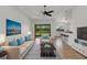 Cozy living room featuring modern furnishings, tile flooring, and view of outdoors at 8079 36Th Street E Cir, Sarasota, FL 34243