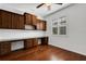 Spacious office featuring built-in desk, storage cabinets, and natural light at 8079 36Th Street E Cir, Sarasota, FL 34243