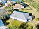 Back aerial view of the home and lush manicured lawn with screened in patio at 8134 Coates Row Pl, Bradenton, FL 34201