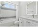 Bathroom with modern fixtures, a shower-tub combo, and decorative tiling at 8134 Coates Row Pl, Bradenton, FL 34201
