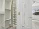 Walk-in closet with built-in shelving and plenty of storage space at 8134 Coates Row Pl, Bradenton, FL 34201