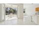 Bright sunroom and open living space with access to the screened-in lanai and views of backyard at 8134 Coates Row Pl, Bradenton, FL 34201