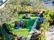 Aerial view of the community playground with multiple play structures and lush landscaping at 8134 Coates Row Pl, Bradenton, FL 34201