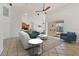 Bright and airy living room with tile floors and a view of the dining area and kitchen at 907 Garland Ave, Nokomis, FL 34275