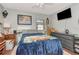 Cozy bedroom featuring a comfortable bed and a mounted TV at 1206 2Nd E Ave, Bradenton, FL 34208
