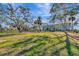 Lush green park adjacent to well-maintained multi-story condos creates a peaceful neighborhood atmosphere at 1206 2Nd E Ave, Bradenton, FL 34208
