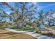 Serene park with picnic tables and informational signs, perfect for outdoor gatherings and community engagement at 1206 2Nd E Ave, Bradenton, FL 34208