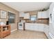 Well-lit kitchen with a large window and stainless steel appliances at 1206 2Nd E Ave, Bradenton, FL 34208