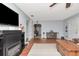 Spacious living room with an electric fireplace and light-colored carpet and walls at 1206 2Nd E Ave, Bradenton, FL 34208