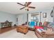 Inviting living room with a ceiling fan, and light colored carpet and walls at 1206 2Nd E Ave, Bradenton, FL 34208