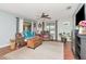 Cozy living room featuring hardwood floors, a ceiling fan, and a decorative rug at 1206 2Nd E Ave, Bradenton, FL 34208