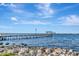 Scenic pier extending into the water, offering stunning views of the city skyline across the bay at 1206 2Nd E Ave, Bradenton, FL 34208