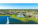 Beautiful aerial showcasing community amenities: a pool, lake with fountain and manicured landscaping in a desirable neighborhood at 12750 Oak Hill Way, Parrish, FL 34219
