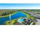 Stunning aerial view of a community pool, fountain and lake in a lushly landscaped neighborhood at 12750 Oak Hill Way, Parrish, FL 34219