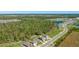 An aerial view of a home in a residential neighborhood near a large conservation area and ponds at 12750 Oak Hill Way, Parrish, FL 34219