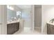 Modern bathroom with a glass-enclosed shower and sleek vanity at 12750 Oak Hill Way, Parrish, FL 34219