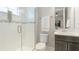 Contemporary bathroom with tiled shower, sleek vanity, and convenient toilet placement at 12750 Oak Hill Way, Parrish, FL 34219