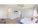 Spacious bedroom featuring TV and an open doorway at 12750 Oak Hill Way, Parrish, FL 34219