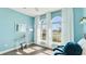 Bedroom showcasing arched windows dressed with white drapes and light streaming onto wood floors at 12750 Oak Hill Way, Parrish, FL 34219