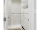 Neat, minimalist closet with organized shelves and drawers; efficient storage solutions at 12750 Oak Hill Way, Parrish, FL 34219