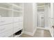 Spacious walk-in closet with custom shelving, drawers, and ample storage space at 12750 Oak Hill Way, Parrish, FL 34219