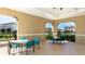 Inviting community area with tables and chairs, offering a perfect outdoor seating space for residents at 12750 Oak Hill Way, Parrish, FL 34219