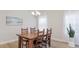 Cozy dining area with a wooden table set and natural light streaming through the windows at 12750 Oak Hill Way, Parrish, FL 34219