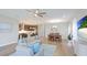 Open-concept living room with combined kitchen and dining area, offering a great space for entertaining at 12750 Oak Hill Way, Parrish, FL 34219