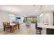 Open-concept living space featuring a dining area, living room, and kitchen, perfect for entertaining at 12750 Oak Hill Way, Parrish, FL 34219
