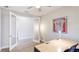Bright office featuring modern lighting, glass french doors, and ample desk space at 12750 Oak Hill Way, Parrish, FL 34219