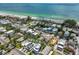 Stunning aerial view of property near a sandy beach and turquoise ocean waters at 2211 Avenue C, Bradenton Beach, FL 34217