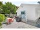 Well maintained backyard featuring a grill, patio seating, and lush tropical landscaping at 2211 Avenue C, Bradenton Beach, FL 34217