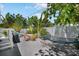 Backyard featuring a hot tub, hammock, and outdoor seating at 2211 Avenue C, Bradenton Beach, FL 34217