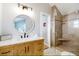 Tastefully renovated bathroom features a spacious shower and a wood vanity at 2211 Avenue C, Bradenton Beach, FL 34217