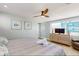 Calm bedroom with a large window providing natural light, light-colored walls, and comfortable furnishings at 2211 Avenue C, Bradenton Beach, FL 34217
