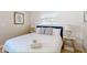 Bright bedroom with a king bed and coastal-themed decor at 2211 Avenue C, Bradenton Beach, FL 34217