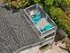 Aerial view of the roof top deck that features outdoor furniture and deck space at 2211 Avenue C, Bradenton Beach, FL 34217