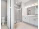 Elegant bathroom with modern double vanity, marble shower, and toilet at 26908 Victoria Pl, Punta Gorda, FL 33955