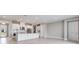 Open concept kitchen with stainless steel appliances, a large island, and views of the living area at 26908 Victoria Pl, Punta Gorda, FL 33955